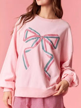 Pink oversized bow crew neck sweatshirt with large embroidered bow and pink teal ribbon details machine wash cold