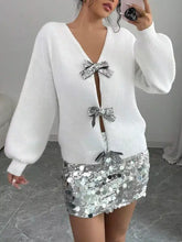 White dropped shoulder knit cardigan with silver sequined bows