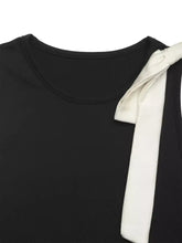 Black sleeveless bodysuit with white satin bow detail at the shoulder for elegant and stylish wear