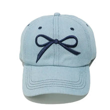 Light blue embroidered denim baseball cap with dark blue bow