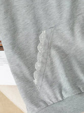 Gray heathered long sleeve hoodie with white lace trim along the pocket edge featuring bow embroidery