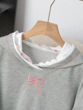 Gray long sleeve hoodie with pink embroidered bow on chest and white lace-trimmed floral inner collar