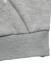 Gray ribbed knit cuff on a bow embroidered long sleeve hoodie made of soft fabric for comfortable wear