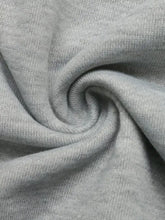 Soft heather gray knit fabric with subtle texture on long sleeve hoodie featuring bow embroidery