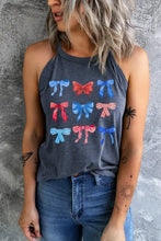 A dark gray round neck tank with bow graphic round pattern in red blue and pink featuring a halter neck design