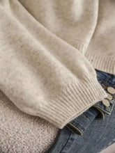 Strickjacke mit V-Ausschnitt und Schleifen-Detail vorne in sanftem Beige, maschinenwaschbar bei Kaltwäsche