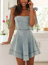 Light blue slightly stretchy denim mini dress with bow shoulder ties and square neck design