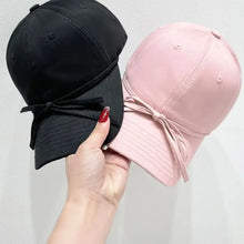 Bow solid color baseball cap in black and pink with ribbon bow