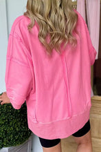 Pink oversized bow v-neck sweatshirt with relaxed fit and ribbed cuffs machine wash cold recommended