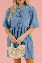 Blue denim dress with puffed sleeves and front tie bowknot round neck detail in a half sleeve denim dress