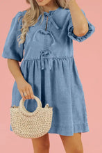Light blue denim dress with puffed sleeves and tied waistband featuring a bowknot round neck design