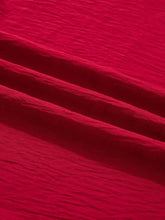 Vibrant red crinkled fabric of braided detail half sleeve blouse with textured slightly wrinkled material