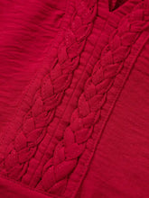 Vibrant red half sleeve blouse with intricate braided detailing along the neckline for elegant wear