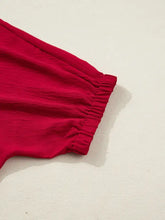 Vibrant red soft textured half sleeve blouse with braided detail and gathered elastic waistband