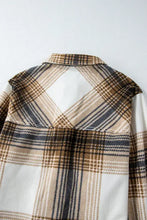 Brown and beige plaid flannel shirt with patch pockets, sleeveless button-down