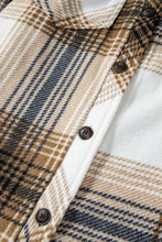Brown and beige plaid flannel shirt with patch pockets, brown buttons