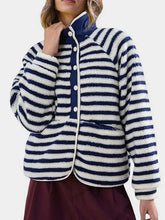 Women’s white cow print fleece jacket with navy and white striped fuzzy fabric