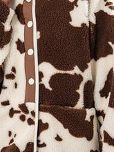 Brown and white cow print fleece jacket for women with brown buttons