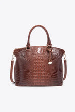Brown crocodile-embossed leather handbag with top handles and strap