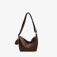 Brown leather crossbody bag with detachable mini pouch
