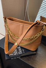 Brown PU leather shoulder bag with textured finish and gold chain accents