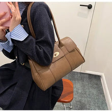 Brown PU leather shoulder bag with gold turn-lock closure