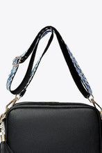 Black textured leather tassel crossbody bag with blue snakeskin strap and gold hardware