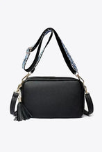 Black leather tassel crossbody bag with adjustable strap