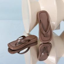 Two brown platform toe post flats slippers with square toe