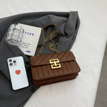 Brown quilted leather crossbody bag with gold chain strap