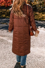Brown quilted puffer coat with fur trim, belt, long sleeves, and button front