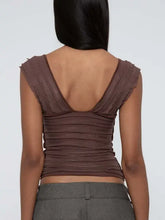 Brown ruched crop top with cap sleeves, scalloped neckline, and open back