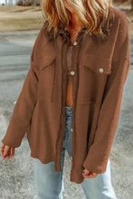 Brown textured long sleeve jacket with button details and pockets