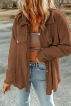 Brown textured long sleeve jacket with button details and pockets