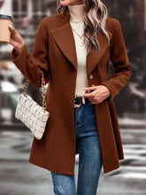Brown wool coat featuring double-breasted design and belt detail