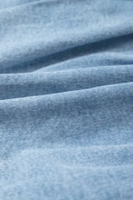 Light blue denim mini skirt fabric with soft worn texture and subtle stitching details for bubble hem denim mini