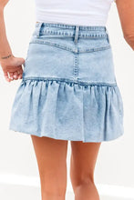 Light-wash denim mini skirt with flared bubble hem and classic waistband stitching in cotton denim fabric