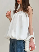 White off-the-shoulder bubble hem tube top with flowing gathered neckline and soft fabric for stylish wear