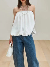 White bubble hem tube top with off-the-shoulder gathered silhouette made of soft cotton fabric