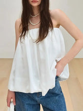 White bubble hem tube top with off-the-shoulder design flowing loose fit and soft fabric material