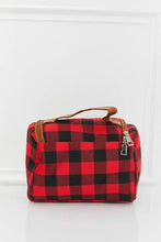 Red and black buffalo plaid printed makeup bag with brown leather handle