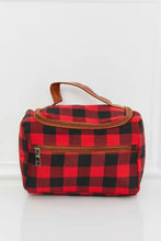 Red and black buffalo plaid printed makeup bag with brown leather handle