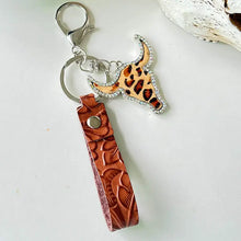 Rhinestone bull keychain with tooled leather strap and cow skull charm