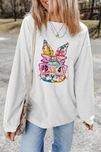 White long-sleeve sweatshirt with colorful floral bunny graphic, machine wash cold