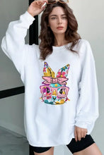 White long sleeve sweatshirt with bunny graphic, machine wash cold