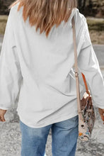 White oversized long sleeve sweatshirt with bunny graphic, machine wash cold