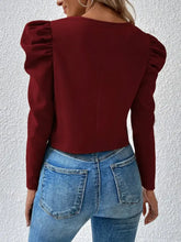 Burgundy cropped jacket with ruffled puff sleeves and zipper closure