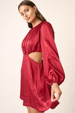 Burgundy satin mini dress with long sleeves and side cutouts