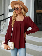 Burgundy square neck puff sleeve blouse with long sleeves and ruffle hem