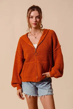 Burnt orange hooded textured cardigan with zip and bell sleeves